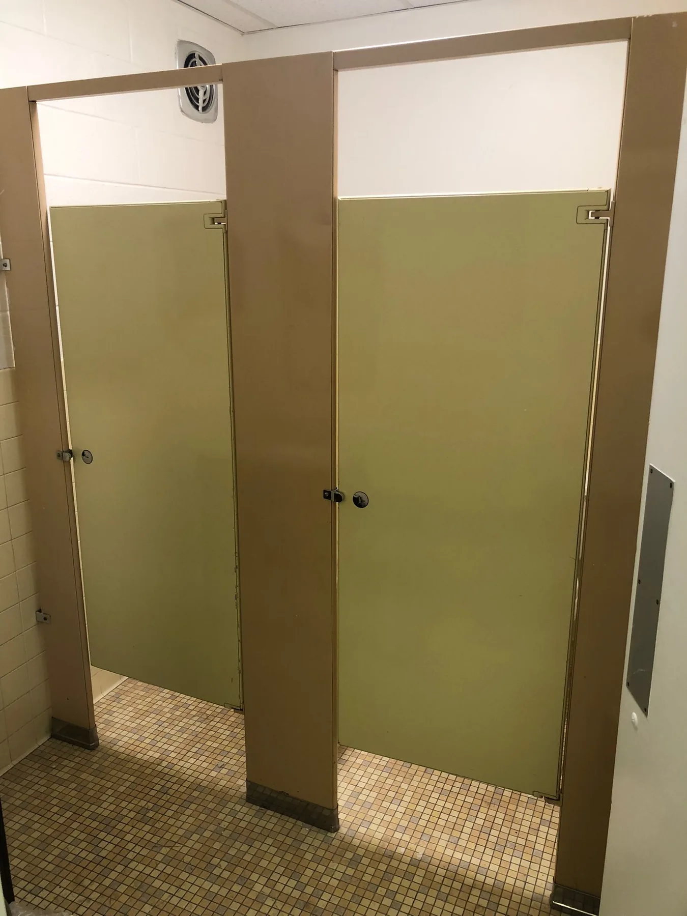 Commercial restroom partitions before repainting