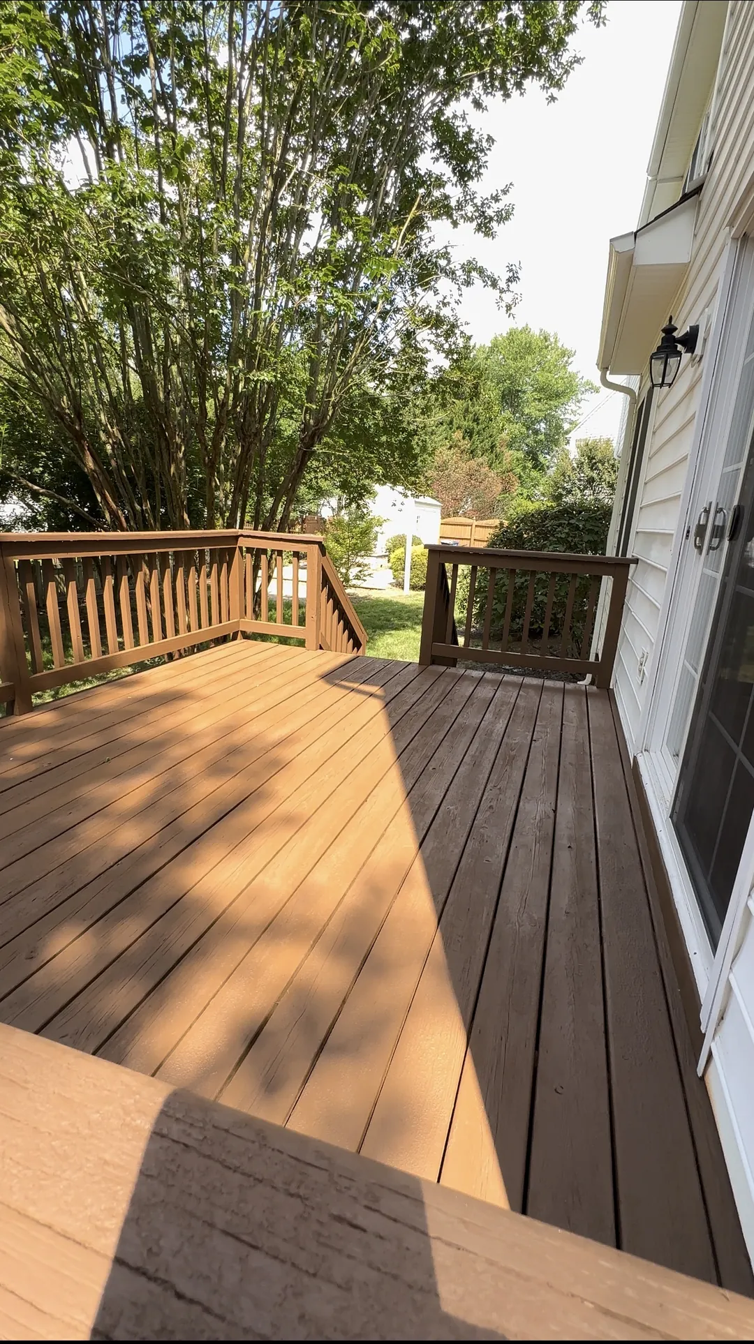 Deck floor and railings after the refreshed brown finish