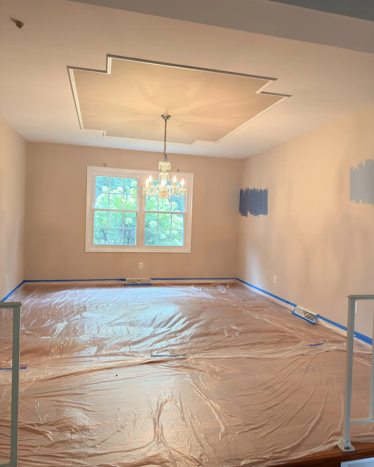 Room carefully covered and taped before Color Factory begins painting